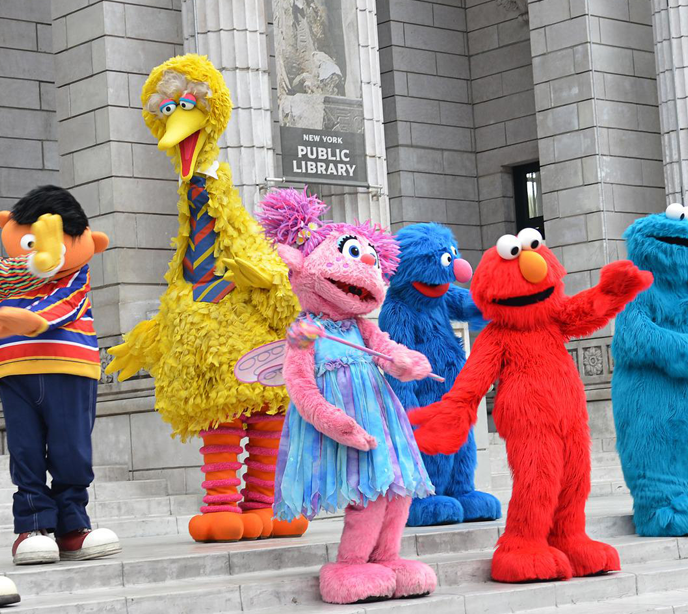 Seven characters from Sesame Street stood on the steps of the New York public library.