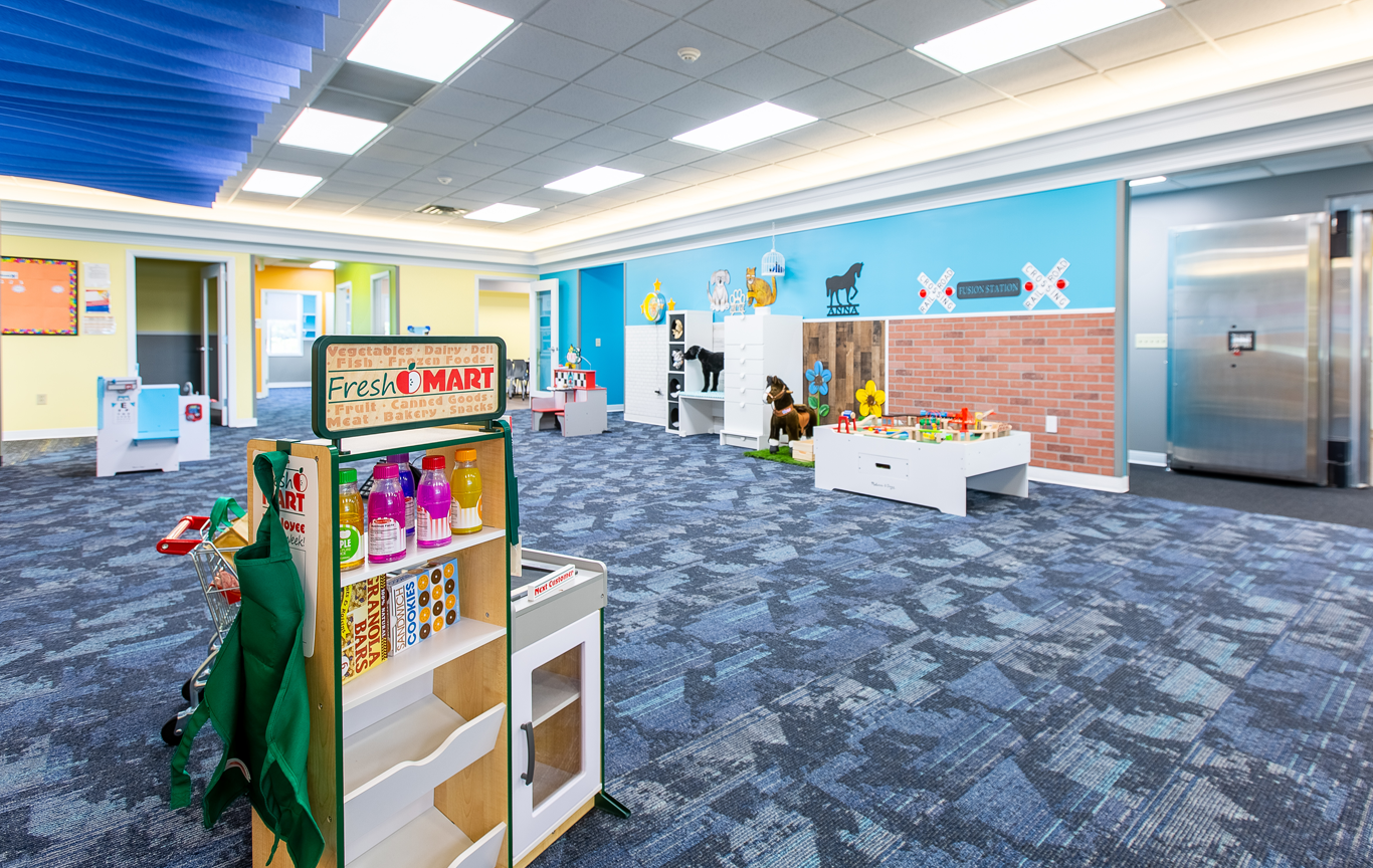 A room in the Lighthouse Autism Center with a toy Fresh Mart, toy animals