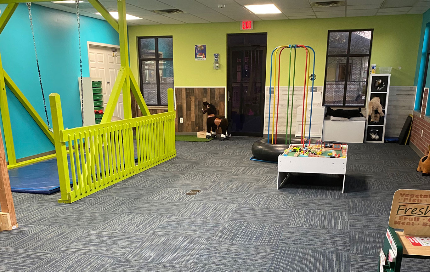 A play room with apparatus in the Lighthouse Autism Center Greenfield location