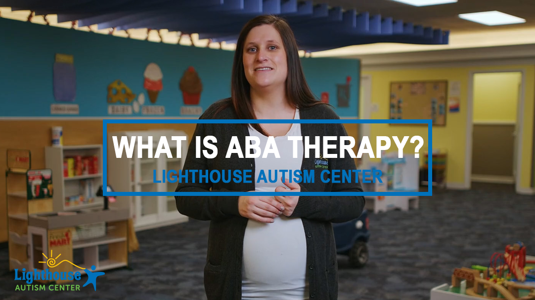 A video frame shot of what is aba therapy at Lighthouse Autism Center with a staff member stood in the center of a therapy room.