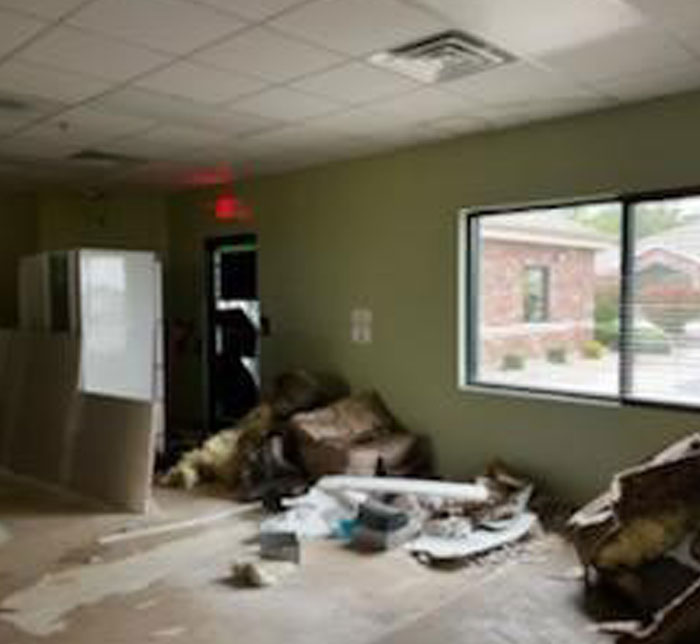 A blurred shot of a therapy room at Decatur Lighthouse Autism Center with trash on the floor and a fridge