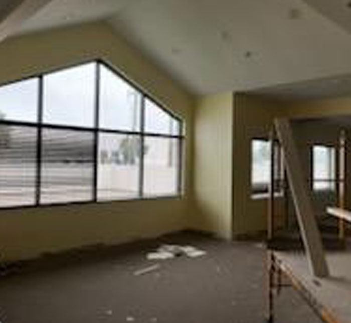 An interior shot inside the Lighthouse Decatur Autism Center of a room with a large window and a table with a piece of wood