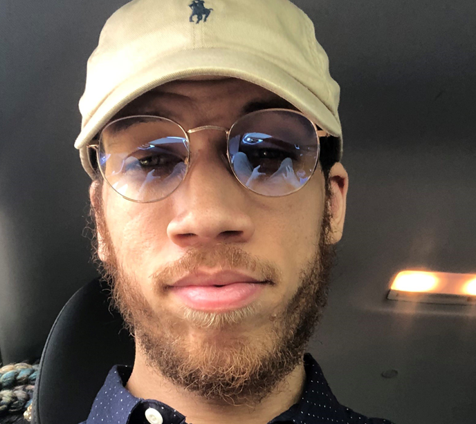 A selfie of a Lighthouse Autism Center employee wearing sunglasses and a cap