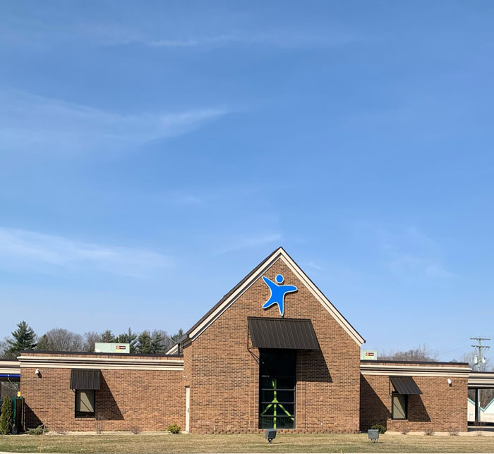 An exterior shot of the South Bend Lighthouse Autism Center with a blue sky above the building