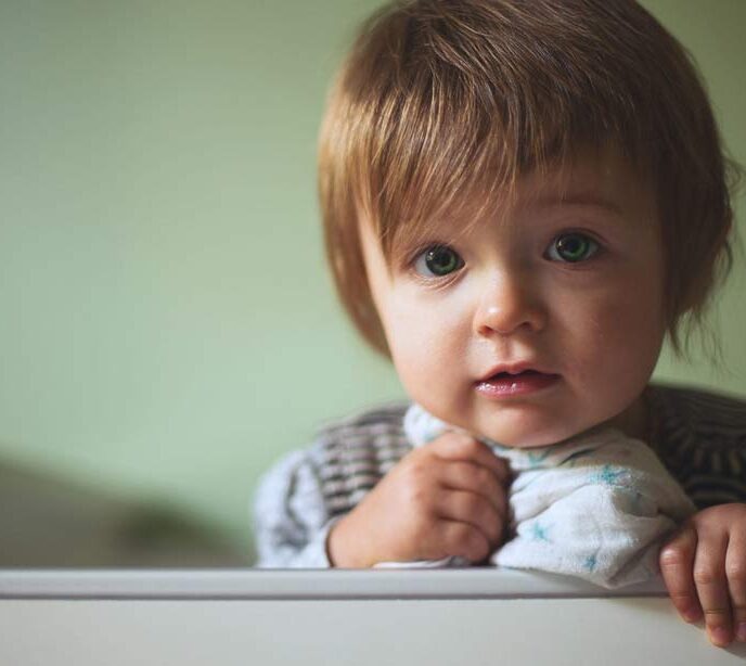 A close up shot of a face of a small child